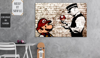 Kép - Banksy rajz szakadt téglafalon